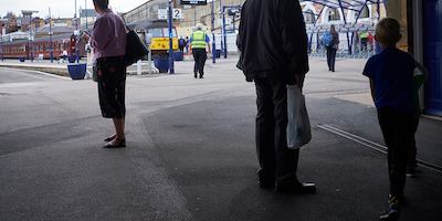 People at a train station