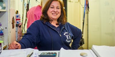 Older worker looking into camera