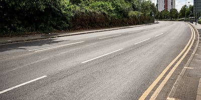 an urban road disappearing into the distance