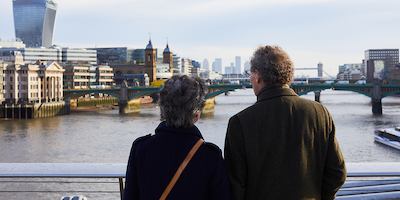 Older couple looking onto a river