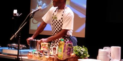 Rupert in a kitchen on stage