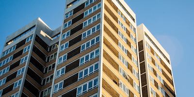 A group of high rise flats in the sunshine