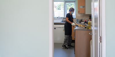 Older woman in community kitchen