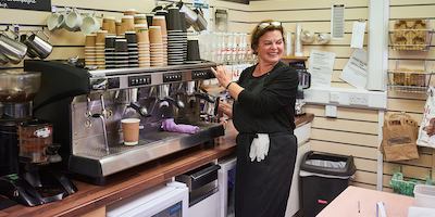 Older worker in cafe shop