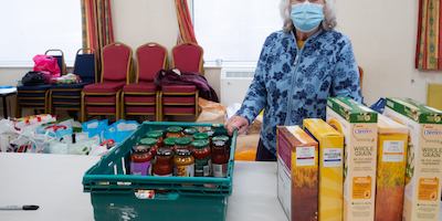 Older woman volunteering at a food bank