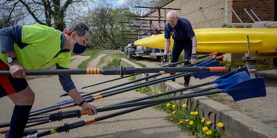 Older man preparing rowing boat