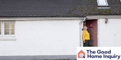 woman stands in front of bungalow