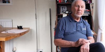 older man sitting down