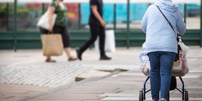 older woman walking down the street