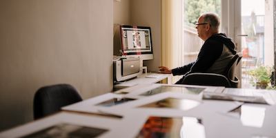 older man working from home