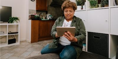 older woman using ipad