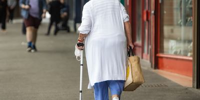 older woman walking down the street