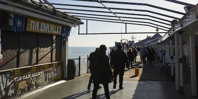 people walking on brighton pier