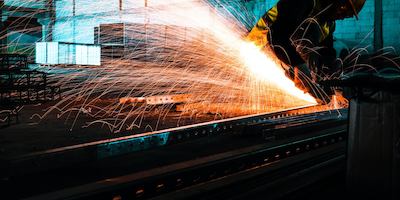 Worker uses welding machine