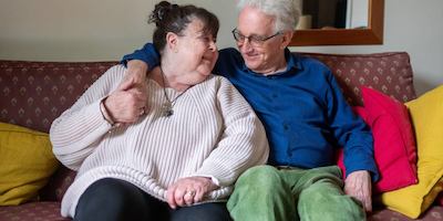 older couple sitting together on the sofa