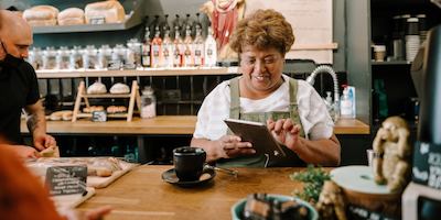 older woman working at a cafe