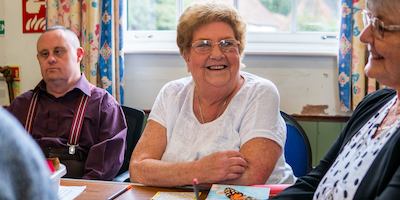 group of older people chatting together