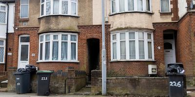 A row of houses with bay windows