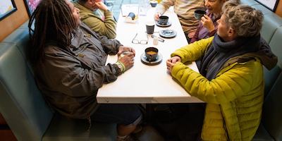 Group of older women sat together and talking