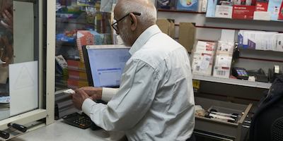 an older worker in the post office