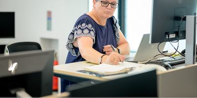 older woman working in an office