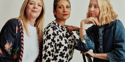 Three older woman looking at the camera