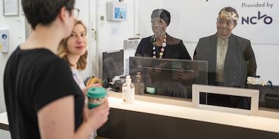 Four employees at an NCVO office are talking together