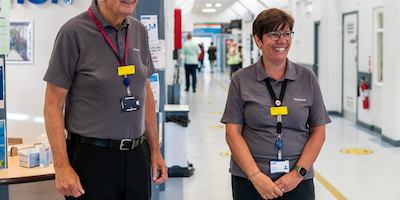 Two older volunteers in a hospital