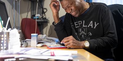 Man smiling at his phone