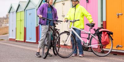 Two people cycling