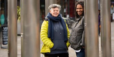 two women standing outside