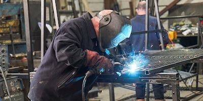 Older man working as a welder