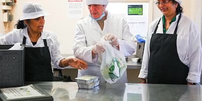 Older people working in a kitchen