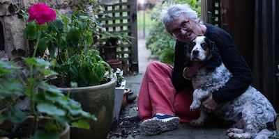 Older woman outside with a dog