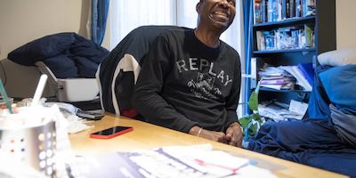 Older man at home smiling