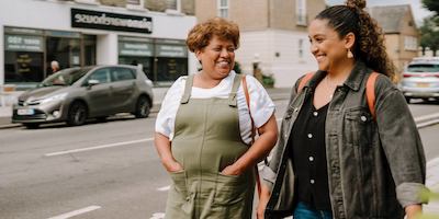 Two women walking down the street