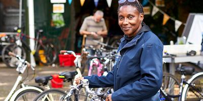 Older woman working with bikes