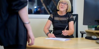 Older woman at desk