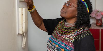 Older-woman-using-thermostat