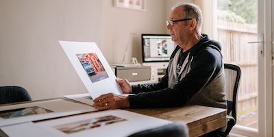 Older-man-looking-at-photos