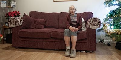 Older-woman-on-sofa