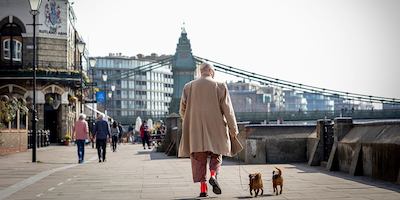 Older-man-walking-two-dogs