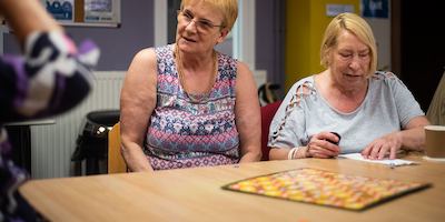 Older-women-socialising-at-a-table