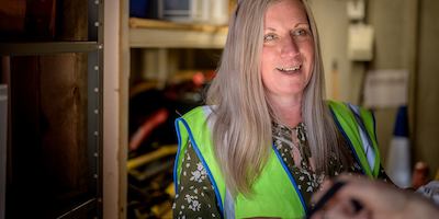 Older-woman-working-in-a-warehouse