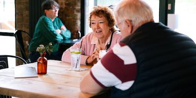 Two-older-people-in-a-cafe