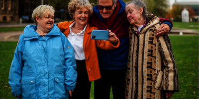 A group of older people taking a selfie