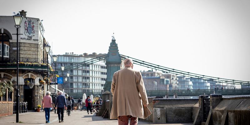 A-man-walking-two-dogs-in-London