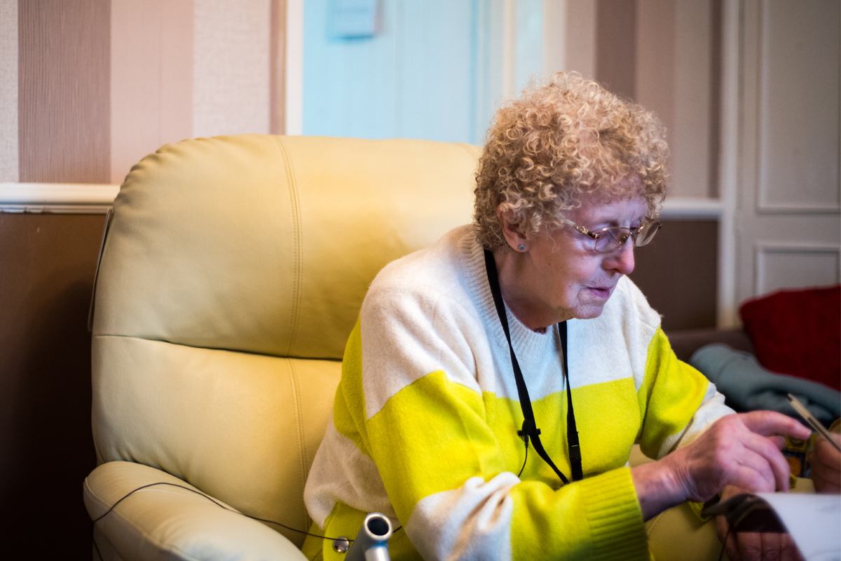 Older lady sitting in an armchair