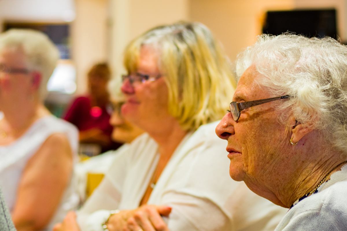 Three woman seated in a row