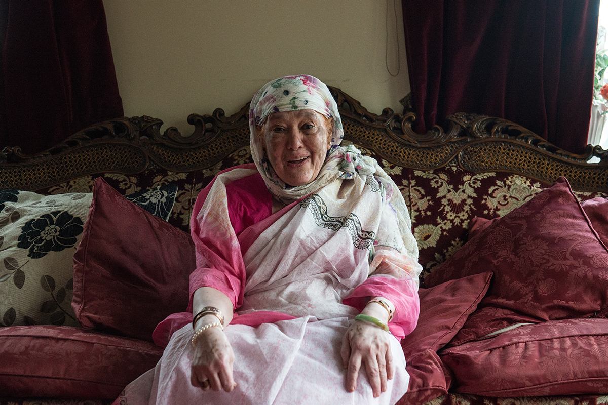 Fatima sitting on a sofa